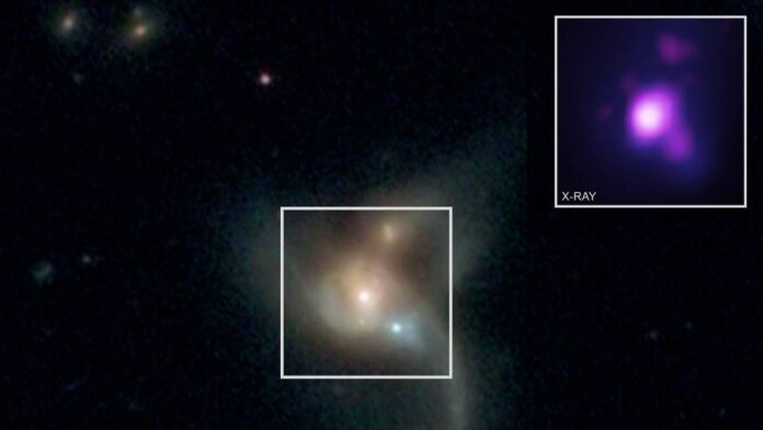 Three Supermassive Black Holes Orbiting Each Other