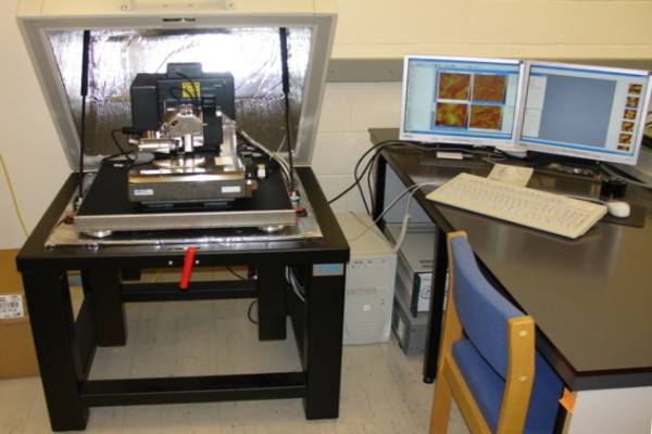 An Atomic Force Microscope on the left with controlling computer on the right.